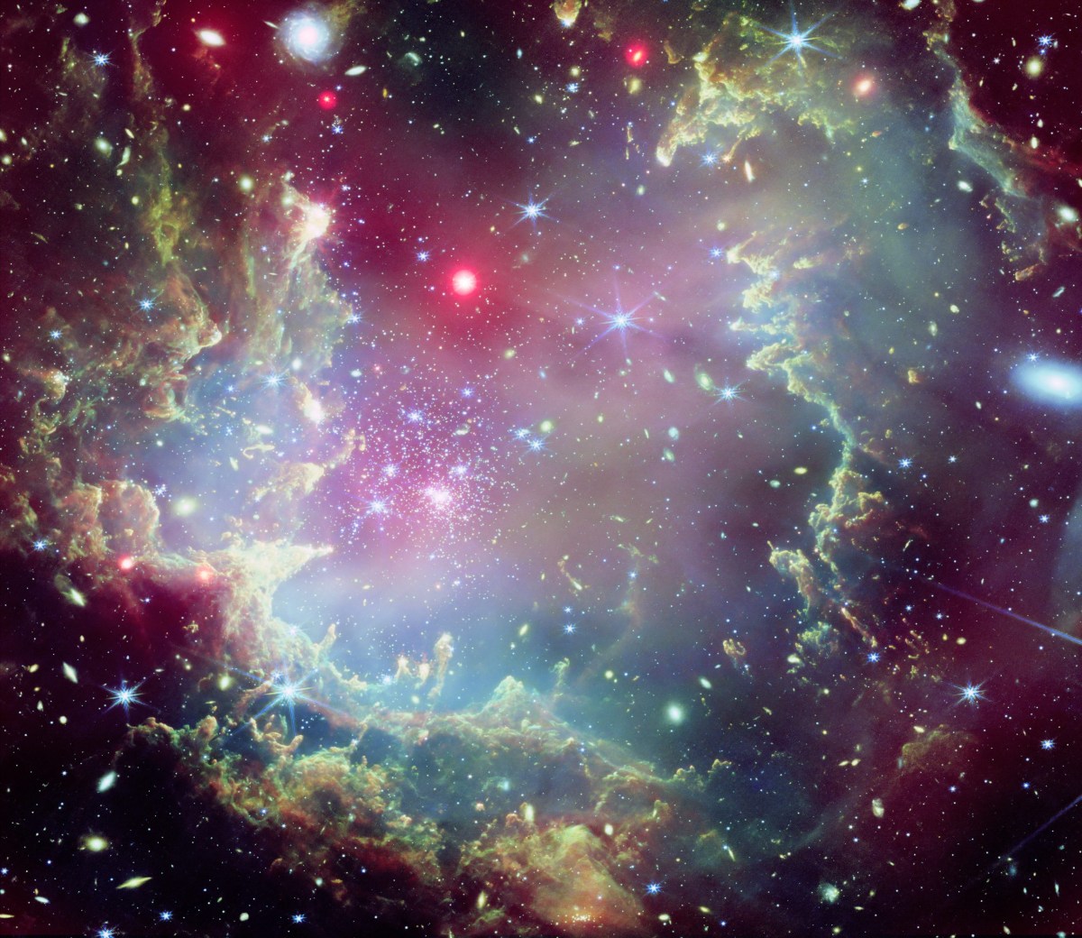 This image of the star cluster NGC 602, located on the outskirts of the Small Magellanic Cloud, combines data captured by NASA’s Chandra X-ray Observatory with an image taken by the James Webb Space Telescope's NIRCam (Near-InfraRed Camera). Credit: NASA