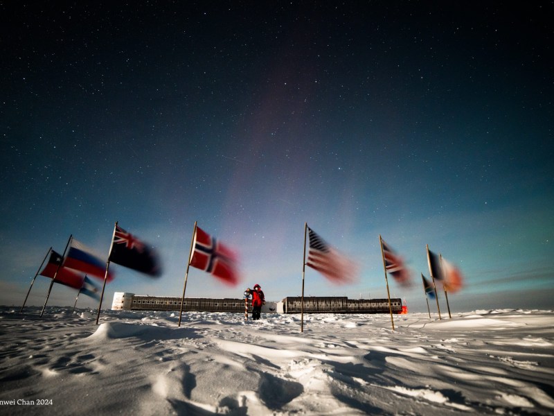 National flags raised during a ceremony at Amundsen-Scott South Pole Station. Image courtesy of Manwei Chan